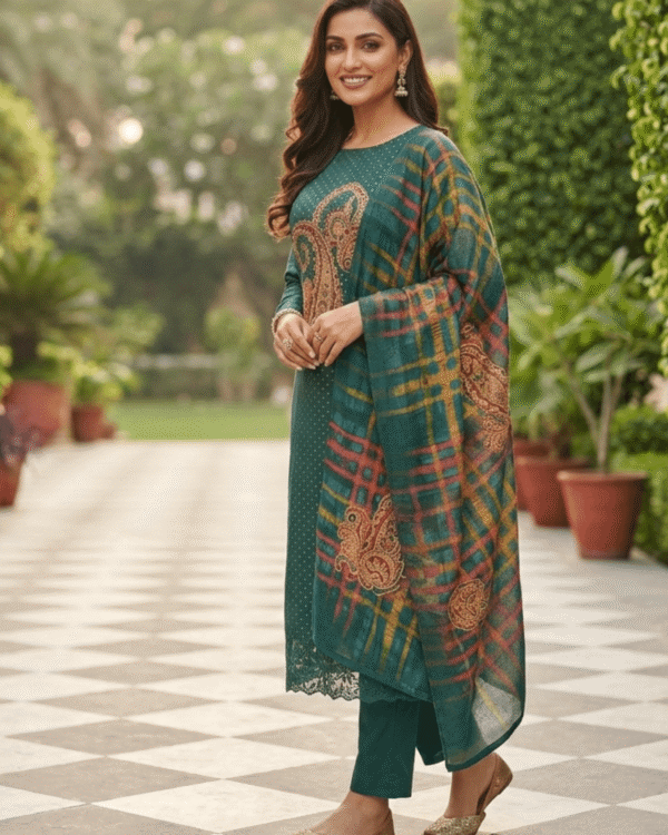 unstitched emerald teal satin suit enhanced with mirror applique and floral threadwork