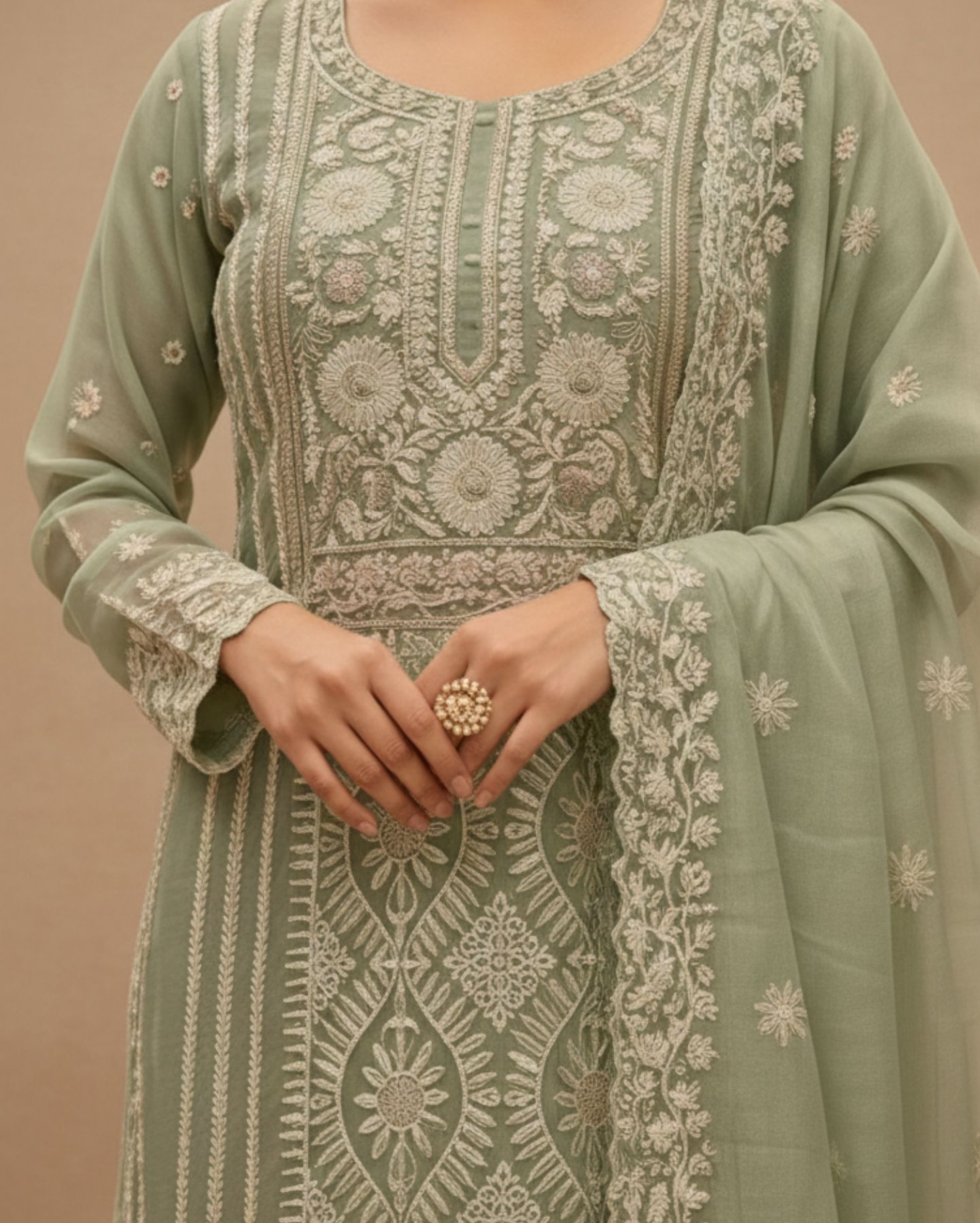 semi stitched soft pastel mint green organza suit with intricate white thread and golden sequin embroidery