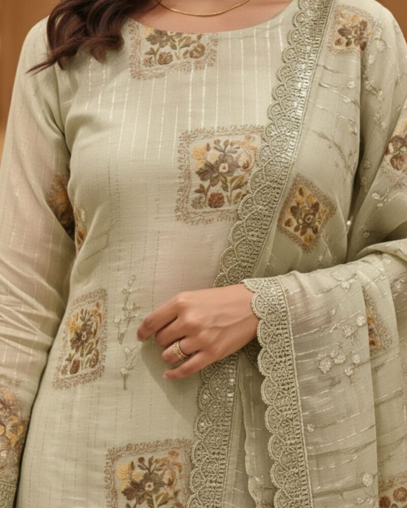 unstitched soft sage green organza suit with subtle vertical thread embroidery detailing