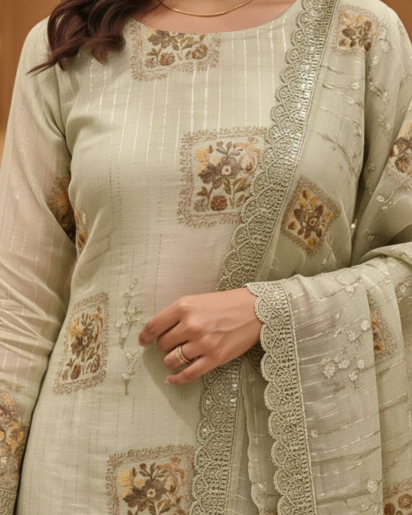 unstitched soft sage green organza suit with subtle vertical thread embroidery detailing