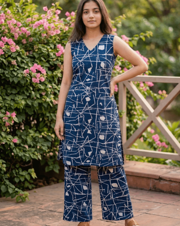 navy blue cotton kurta pant set with abstract white print